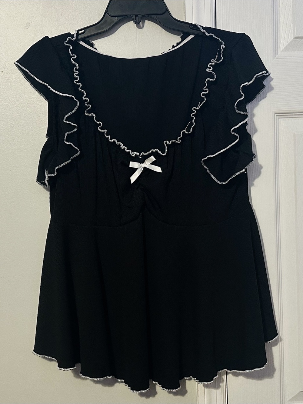 black and white peplum blouse with bow detail